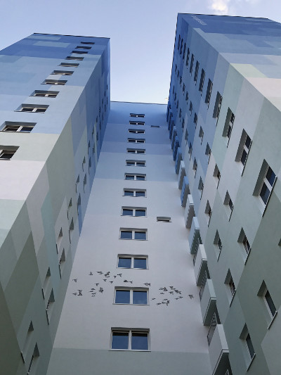 high-rise building with color blocking painting technique